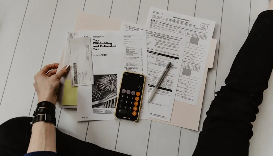 Professional reviewing financial documents and a calculator