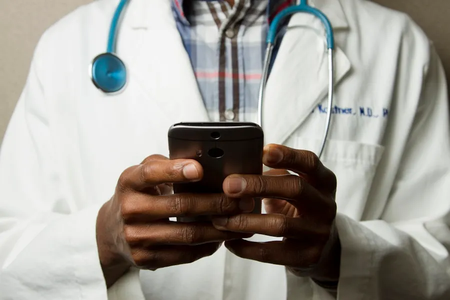 Doctor using a smartphone while wearing a stethoscope